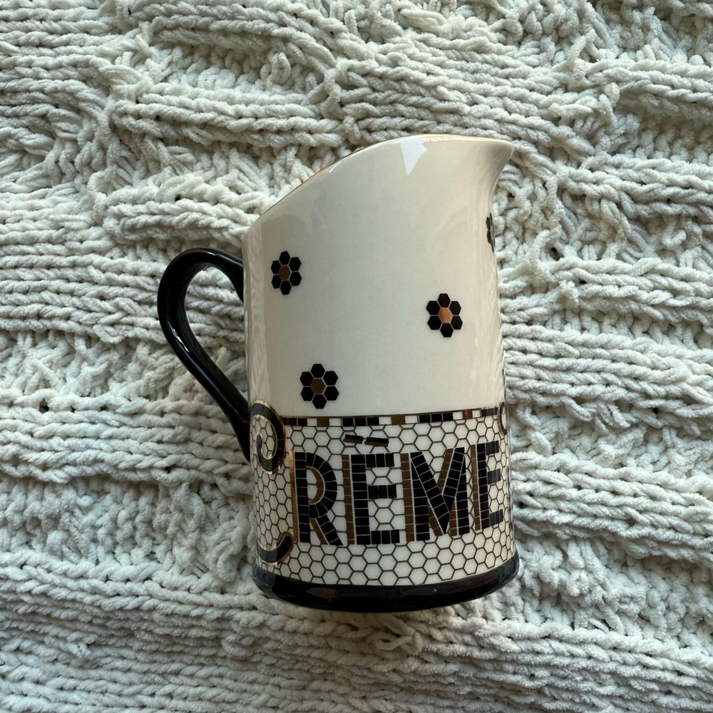 Anthropologie Cream Ceramic Pitcher with Black Handle and Floral Accents